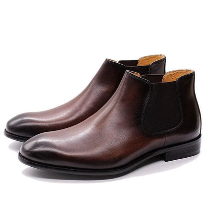 Men's brown leather ankle dress boots with side elastic panels on white background