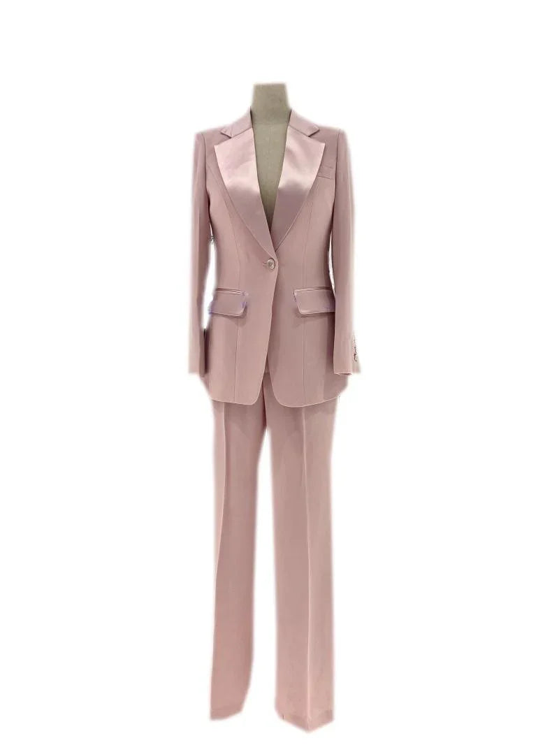 Pink silk satin women's wedding pantsuit with blazer and trousers on mannequin
