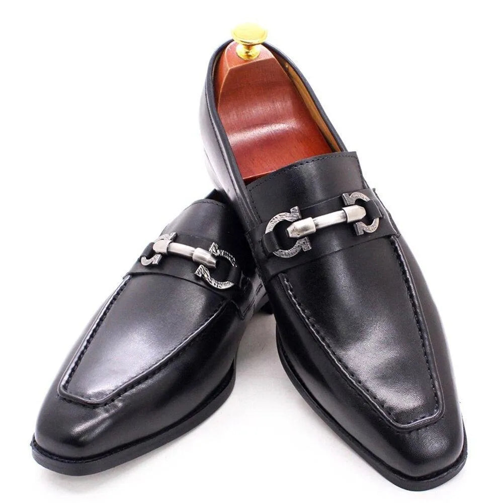 Black leather slip-on loafer shoes for men with metal horsebit detail on white background