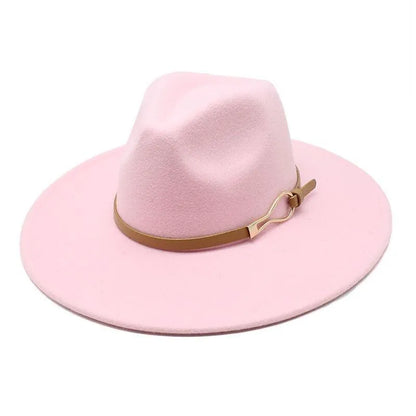 Unisex pink felt fedora hat with wide brim and brown band on white background