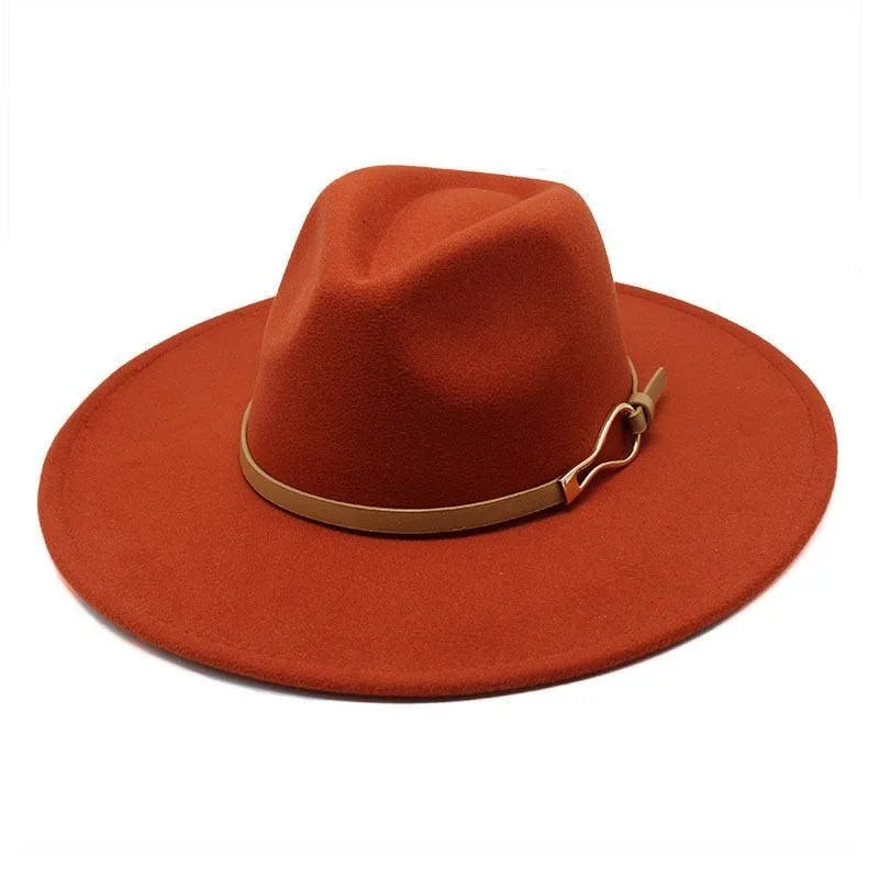 Unisex rust felt fedora hat with wide brim and tan band on white background